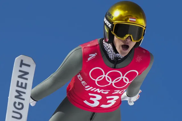 Eva Pinkelnig, of Austria, soars through the air during a women's normal hill ski jumping training session at the 2022 Winter Olympics, Friday, February 4, 2022, in Zhangjiakou, China. (Photo by Andrew Medichini/AP Photo)