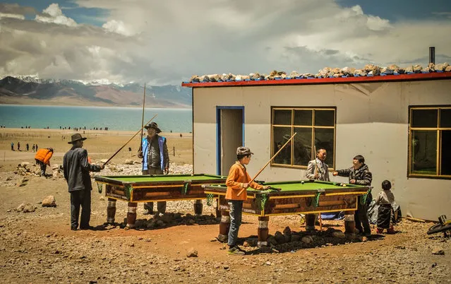 Finalist, People category. A group of locals playing billiards by Namtso Lake, Tibet. (Photo by Vincent Cheng/Smithsonian.com)