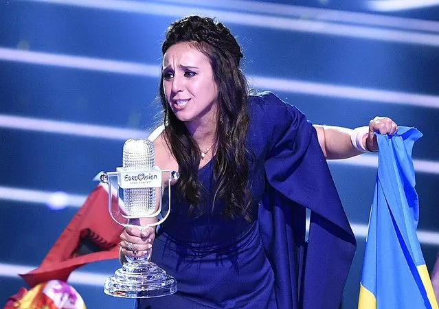 Ukraine's Jamala celebrates with the trophy after winning the Eurovision Song Contest final with the song '1944' in Stockholm, Sweden, Sunday, May 15, 2016. (AP Photo/Martin Meissner)