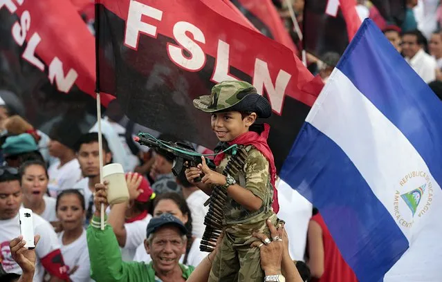 A boy dressed as a military takes part in celebrations to mark the 36th anniversary of the Sandinista Revolution at Juan Pablo II Square in Managua, Nicaragua July 19, 2015. (Photo by Oswaldo Rivas/Reuters)
