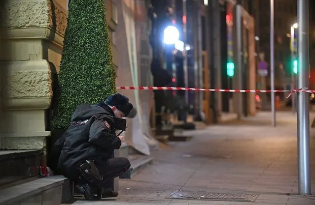A police officer by a shooting site outside the headquarters of the Russian Federal Security Service in Moscow, Russia on December 19, 2019. An unidentified man opened fire with a Kalashnikov assault rifle. (Photo by Maxim Grigoryev/TASS via Getty Images)