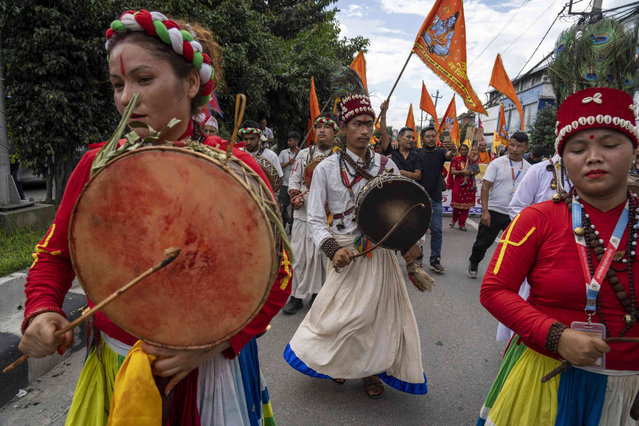 People participate in a protest against secularism, demanding the reinstatement of Nepal as a Hindu state and the restoration of the monarchy near parliament building in Kathmandu, Nepal, Friday, September 13, 2024. (Photo by Niranjan Shrestha/AP Photo)