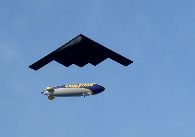 The B-2 Spirit military aircraft passes under the Goodyear airship above Colorado Boulevard during the Rose Parade in Pasadena, Calif., Wednesday, January 1, 2020. (Photo by Dean Musgrove/The Orange County Register via AP Photo)