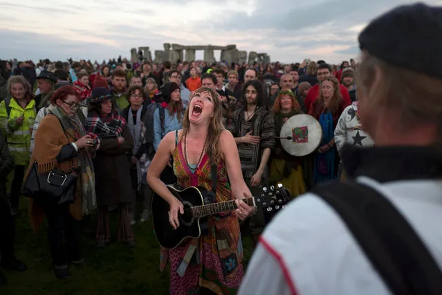 Revellers celebrate the summer solstice at Stonehenge on Salisbury Plain in southern England, Britain June 21, 2016. (Photo by Kieran Doherty/Reuters)