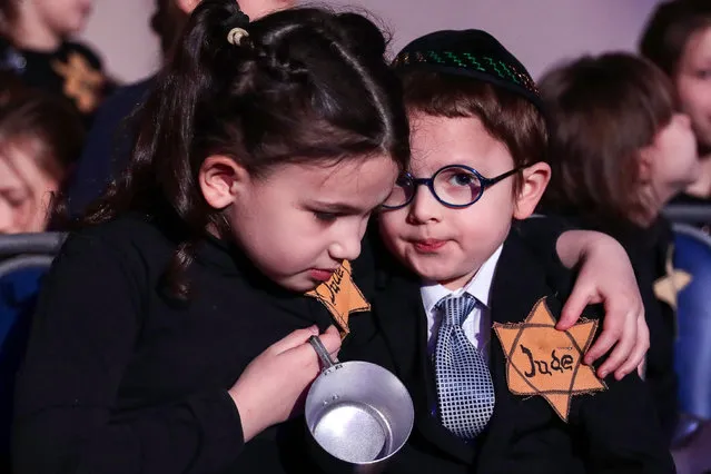 Children take part in a memorial ceremony for Holocaust victims at the Synagogue Jewish community center in Yekaterinbueg, Russia on January 27, 2020. January 27 was named International Holocaust Remembrance Day by the General Assembly of the United Nations in 2005. (Photo by Donat Sorokin/TASS)