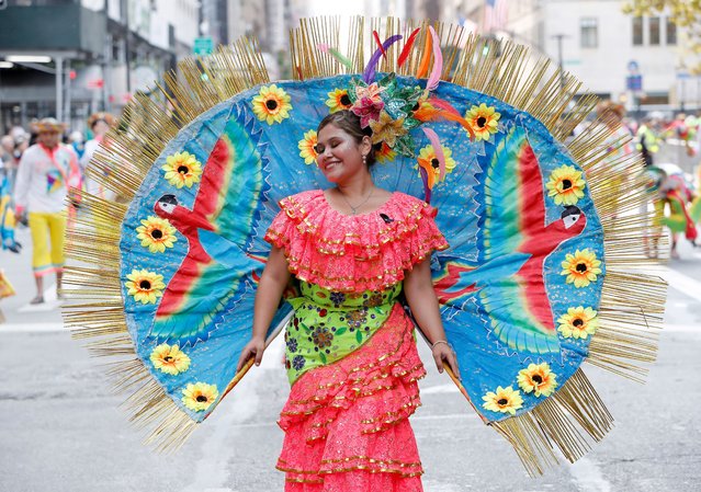 Marchers wear traditional costumes in the annual Hispanic Day Parade in New York on October 12, 2024, celebrating the heritage of 20 Spanish-speaking countries. (Photo by Andrew Schwartz/Splash News and Pictures)