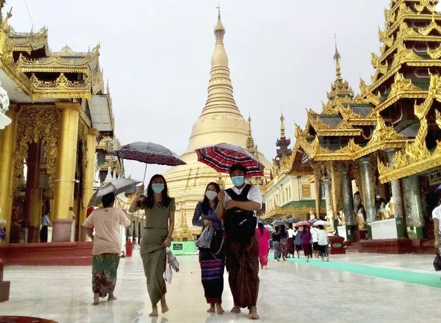 Pilgrims visit Myanmar famous Shwedagon Pagoda in Yangon, Myanmar on Sunday, June 19, 2022. Several visitors said they came to the famous temple to say prayers for Aung San Suu Kyi, the country's ousted leader, on her 77th birthday, which she spent in military detention. (Photo by AP Photo/Stringer)