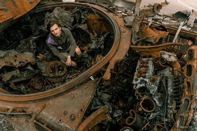 A student poses for a high school graduation photoshoot, as Russia's attack on Ukraine continues, in Chernihiv, Ukraine on June 5, 2022. (Photo by Instagram/@senykstas/Handout via Reuters)