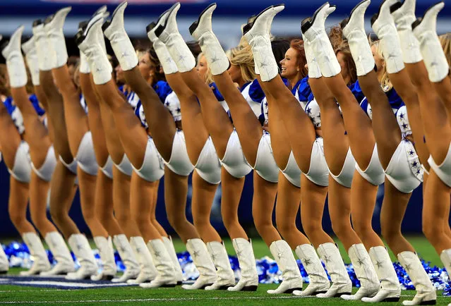 The Dallas Cowboys cheerleaders perform prior to the start of the game against the Minnesota Vikings at Cowboys Stadium on November 3, 2013 in Arlington, Texas. (Photo by Jamie Squire/Getty Images)