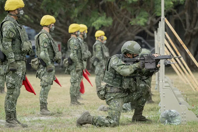 In this photo released by the Taiwan Presidential Office, Taiwanese soldiers go through a drill as Taiwan's President Tsai Ing-wen visits a camp in Hualien, in eastern Taiwan on Tuesday, September 6, 2022. Taiwanese President Tsai Ing-wen said Tuesday that China is conducting “cognitive warfare” by spreading misinformation in addition to its regular incursions into nearby waters and airspace intended at intimidating the self-governing island. (Photo by Taiwan Presidential Office via AP Photo)
