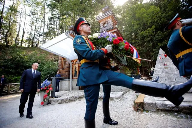 Russian President Vladimir Putin attends the commemoration of 100 years of the Russian chapel in Vrsic, Slovenia, July, 30, 2016. The Russian chapel was built in 1916 in memory of 250 Russian prisoners of war who were caught in an avalanche while building the road over the Vrsic. (Photo by Srdjan Zivulovic/Reuters)