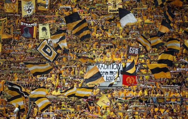 Football Soccer, Dynamo Dresden vs RB Leipzig, German Cup (DFB Pokal), DDV-Stadion, Dresden, Germany on August 20, 2016. Dynamo Dresden's fans display banners and wave flags. (Photo by Axel Schmidt/Reuters)
