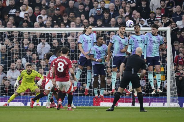 Manchester United's Bruno Fernandes (8) scores his side's opening goal during the English Premier League soccer match between Manchester United and Arsenal at Old Trafford stadium in Manchester, England, Sunday, March 9, 2025. (Photo by Dave Thompson/AP Photo)