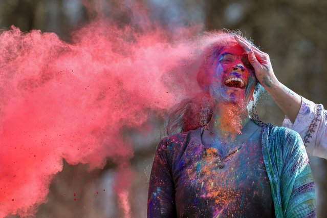 Members of the public take part in Holi festival celebrations at Rouken Glen Park on March 15, 2025 in Glasgow, Scotland. The Holi Hai Hindu Festival is celebrated as a way to welcome in spring, and also is seen as a new beginning where people can release all their inhibitions and start afresh. (Photo by Jeff J. Mitchell/Getty Images)