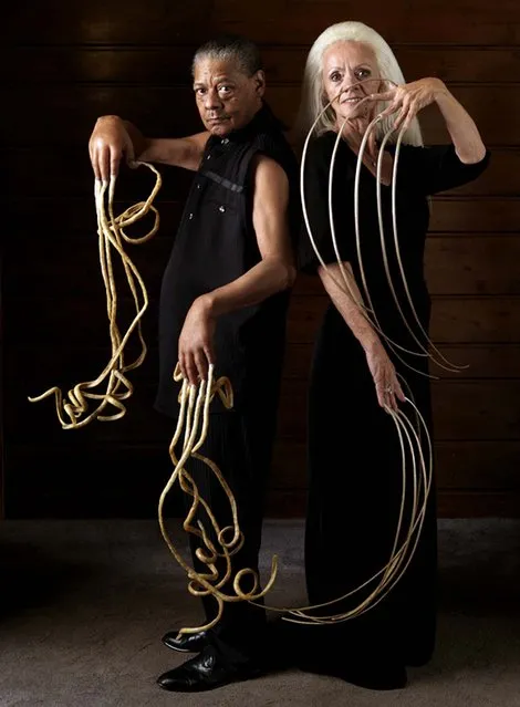 Lee Redmond (right), former record holder for longest fingernails (28 ft, 4 in), poses with Melvin Booth, owner of the record for longest male nails (29 ft, 8 in). This photo was taken for the 2010 Edition of Guinness World Records, just a few months prior to an accident which resulted in Redmond losing her fingernails. (Photo by Ronald Mackechnie/Guiness World Records Book Launch/Associated Press)