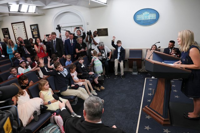 Children raise their hands to ask White House press secretary Karoline Leavitt questions during a press briefing for the Take Our Sons and Daughters to Work Day event, at the White House, in Washington on May 20, 2025. (Photo by Leah Millis/Reuters)