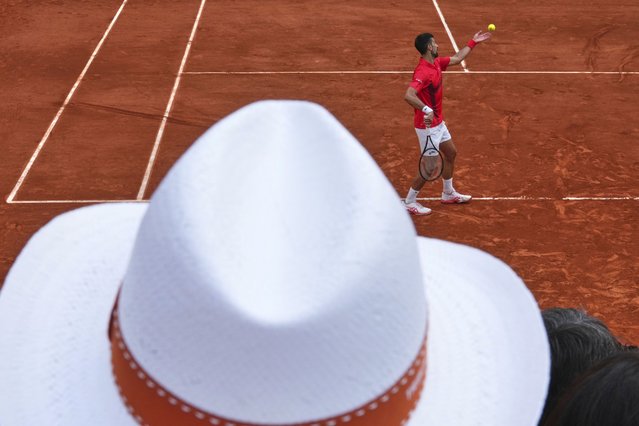 Serbia's Novak Djokovic serves against France's Corentin Moutet during their second round match of the French Tennis Open, at the Roland-Garros stadium, in Paris, Thursday, May 29, 2025. (Photo by Lindsey Wasson/AP Photo)