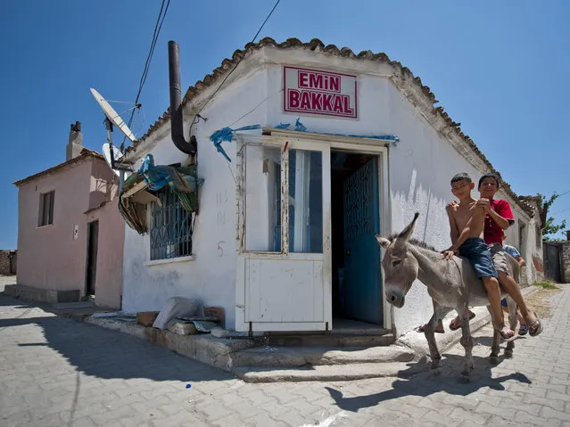 “Emin Bakkal (Emin Grocery)”. Emin Bakkal (Emin Grocery) located in Mutlu Köy (Happy Village) near Ayvalık is a small place where kids coming on their donkeys to buy chocolate. Photo location: Balikesir Ayvalik. (Photo and caption by Melih Sular/National Geographic Photo Contest)