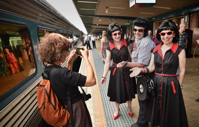 Elvis fans pose before boarding a train to The Parkes Elvis Festival, in Sydney on January 11, 2018. The Parkes Elvis Festival is an annual event celebrating the music and life of Elvis Presley in the New South Wales town of Parkes. (Photo by Peter Parks/AFP Photo)