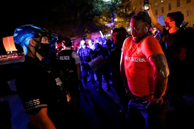 Demonstrators face off with police officers during a protest as police block their path on Constitution Avenue in Washington, August 27, 2020. (Photo by Andrew Kelly/Reuters)