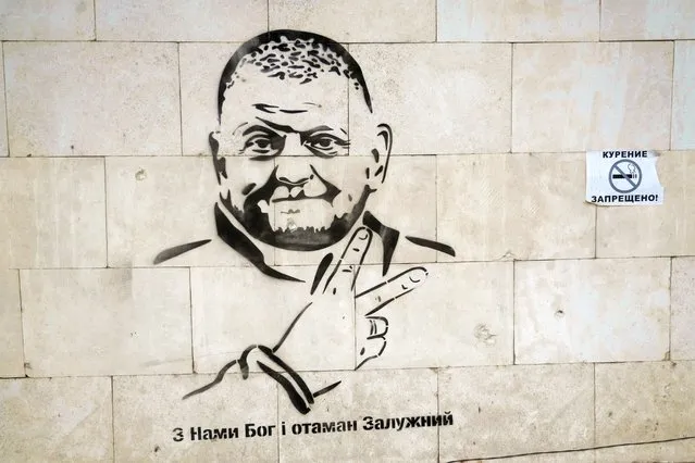 A graffiti of Commander in Chief of the Ukrainian armed Forces Valerii Zaluzhnyi is seen on a terminal of an international airport after Russia's retreat from Kherson, in Chornobaivka, outside of Kherson, Ukraine on November 16, 2022. (Photo by Valentyn Ogirenko/Reuters)