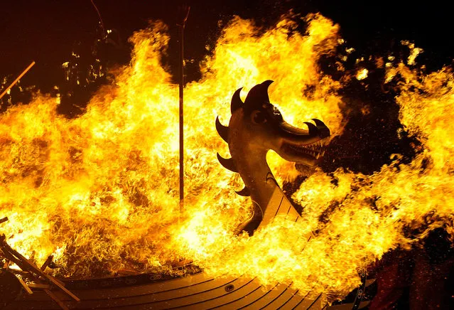 The Viking longboat burns during the annual Up Helly Aa festival in Lerwick, Shetland Islands, on January 28, 2014. Up Helly Aa celebrates the influence of the Scandinavian Vikings in the Shetland Islands and culminates with up to 1,000 “guizers” (men in costume) throwing flaming torches into their Viking longboat and setting it alight later in the evening. (Photo by Andy Buchanan/AFP Photo via Getty Images)