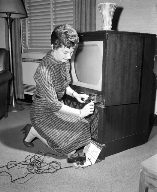 In this November 6, 1956, file photo, Barbara Mahar attaches a new TV accessory to her television set in New York City. An instant tuner, it converts television sets to remote control tuning in three minutes.TV was key to the world baby boomers were born into: a newly modernized world whose every problem (with the possible exception of the Cold War) seemed to promise an available solution. Polio would be cured! Man would go into space! Even African-Americans, oppressed for so long, had new reason for hope. TV chronicled this bracing wave of wonder and potential, and built upon it as an essential part of what distinguished boomers: They were pampered and privileged and ushered toward a sure-to-be-glorious future. (Photo by Robert Kradin/AP Photo)