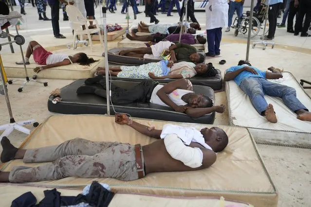 Victims of a train crash receive treatment outside the emergency unit of the Lagos general hospital in Ikeja Lagos, Nigeria, Thursday March 9, 2023. (Photo by Sunday Alamba/AP Photo)
