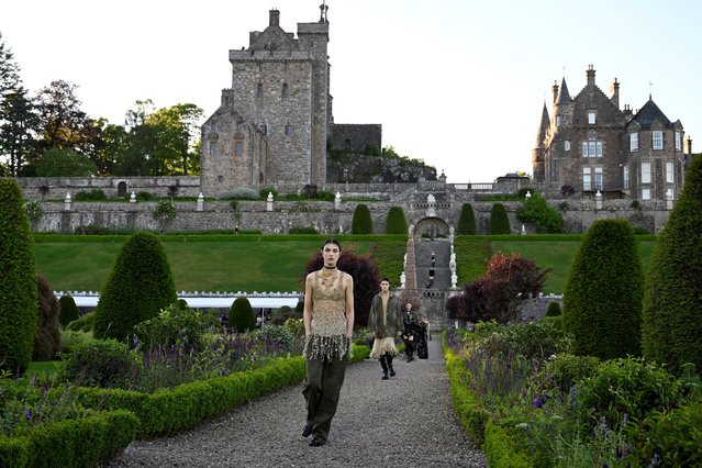 Models present outfit creations during a Christian Dior cruise show at Drummond castle, in Perthshire, Scotland, Britain on June 3, 2024. (Photo by Lesley Martin/Reuters)