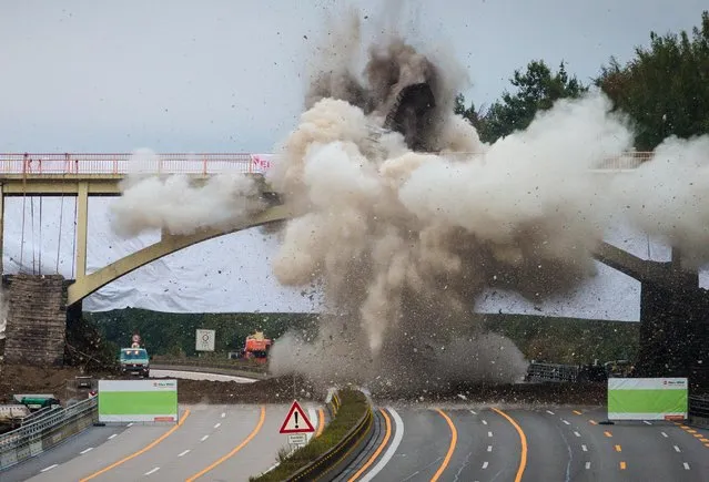 A pedestrian bridge at  highway A8 near Sindelfingen, Germany,  is blown up to broaden the highway Saturday October 15,  2016. The highway will remain at full closure in both directions between Stuttgart junction and Leonberg – East  junction throughout the weekend.  (Photo by Christoph Schmidt/dpa via AP Photo)