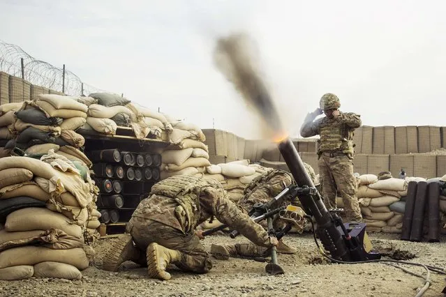 U.S. soldiers from the 3rd Cavalry Regiment fire a 120mm mortar during an exercise on forward operating base Gamberi in the Laghman province of Afghanistan December 24, 2014. (Photo by Lucas Jackson/Reuters)