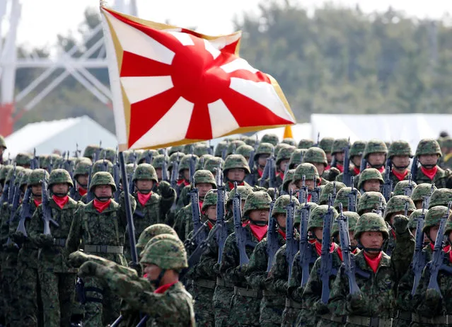 Members of Japan's Self-Defence Forces' infantry unit march during the annual SDF ceremony at Asaka Base, Japan, October 23, 2016. (Photo by Kim Kyung-Hoon/Reuters)