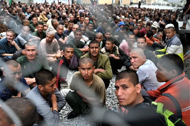 Men gather inside the courtyard of a drug rehabilitation and treatment centre on the outskirts of Kabul on April 18, 2023. (Photo by Wakil Kohsar/AFP Photo)