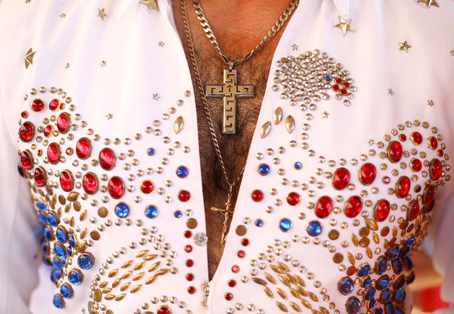 The outfit of an Elvis tribute artist is seen as he waits for the Elvis Express headed to the 2015 Parkes Elvis Festival to depart from Central Station on January 8, 2015 in Sydney, Australia. The Parkes Elvis Festival is held annually over five days, timed to coincide with Elvis Priestly's birthday in January. Over 1300 attendees are expected at this festival to celebrate Elvis' 80th birthday.  (Photo by Mark Kolbe/Getty Images)