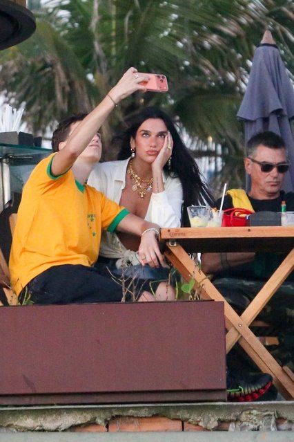 Stylish pop star Dua Lipa is spotted snapping selfies while hanging out with her family at Ipanema Beach in Rio de Janeiro on November 19, 2025. (Photo by JUCE/BACKGRID)