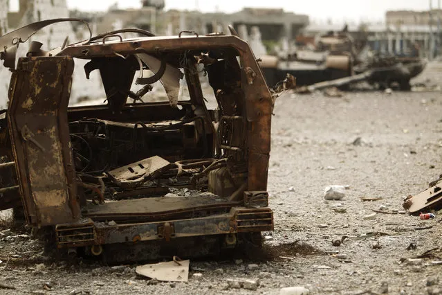 A view shows military vehicles destroyed during recent fighting between the Yemeni army and al Qaeda-linked militants in the southern Yemeni city of Zinjibar June 14, 2012. (Photo by Khaled Abdullah/Reuters)