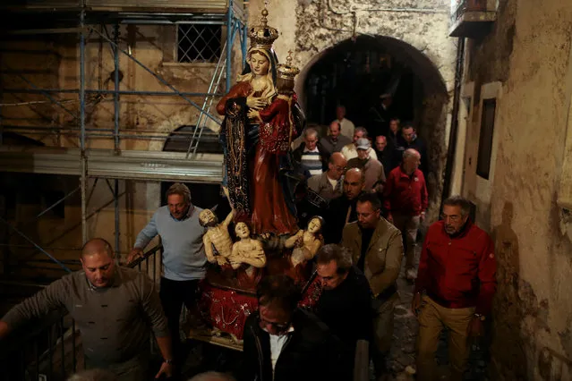 Men carry a statue of the Virgin Mary during a religious  procession held every year to bless shepherds who at the beginning of the winter would walk with their herds to the south of Italy for warmer weather, Castel del Monte, in the province of L'Aquila in Abruzzo, inside the national park of the Gran Sasso e Monti della Laga, Italy, September 8, 2016. (Photo by Siegfried Modola/Reuters)