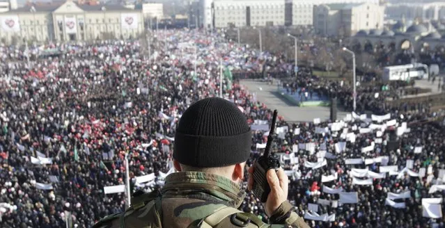 A member of law enforcement forces stands guard during a rally to protest against satirical cartoons of prophet Mohammad, in Grozny, Chechnya January 19, 2015. (Photo by Eduard Korniyenko/Reuters)