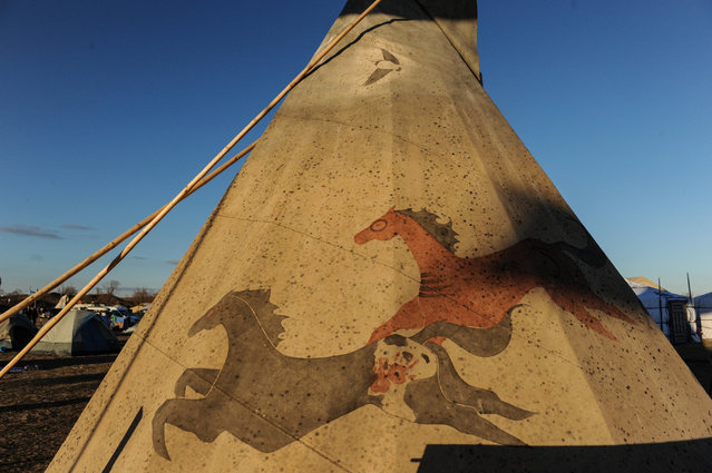 A painting of two horses is seen on a tipi in an encampment during a protest against the Dakota Access pipeline near the Standing Rock Indian Reservation near Cannon Ball, North Dakota November 7, 2016. (Photo by Stephanie Keith/Reuters)