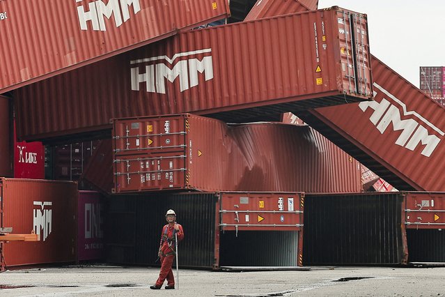 Fallen cargo containers are piled up after Typhoon Krathon made landfall in Kaohsiung, Taiwan on October 4, 2024. (Photo by Ann Wang/Reuters)
