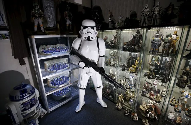 Star Wars fan Takaya Yoshino, 28, poses for a photograph while dressed as a Stormtrooper at his home in Numazu, west of Tokyo, Japan November 30, 2015. Yoshino said he spends almost all his spare time and money on Star Wars. On their honeymoon Yoshino and his wife attended a Star Wars weekend at Seaworld in Florida. He said his wife is understanding of his hobby and is a Disney fan. (Photo by Issei Kato/Reuters)