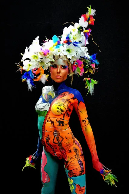 A participant poses with her body paintings designed by bodypainting artist Sonja Wiesendanger during the 16th World Bodypainting Festival on July 5, 2013 in Poertschach am Woerthersee, Austria. (Photo by Didier Messens/Getty Images)
