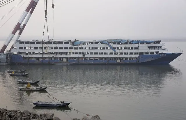 The Eastern Star, the cruise ship which went down in the Jianli section of the Yangtze River in June, is seen in Jianli, Hubei province, December 30, 2015. A formal inquiry has concluded that freak weather led to the sinking of a Yangtze River cruise ship in June that killed 442 people and recommended that the captain be investigated for possible crimes, media reported. (Photo by Darley Shen/Reuters)