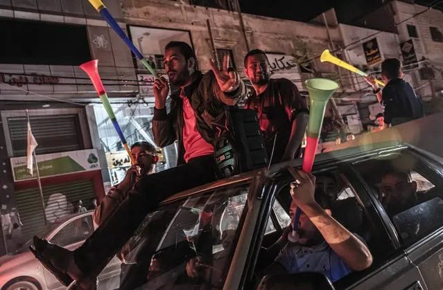 Palestinians celebrate the cease-fire agreement between Israel and Hamas on May 21, 2021 in Gaza City, Gaza. Yesterday, Israel's cabinet and Hamas, the militant group that rules Gaza, agreed on a ceasefire starting in the early hours of this morning. The recent fighting, which has killed over 230 Palestinians, many of them women and children, and 13 Israelis, began on May 10th after rising tensions in East Jerusalem. (Photo by Fatima Shbair/Getty Images)