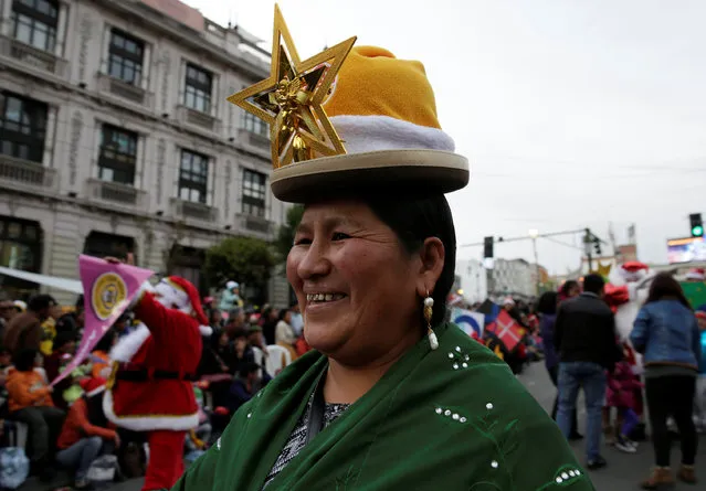 An Aymara woman participates in a Christmas parade in La Paz, Bolivia, December 10, 2016. (Photo by David Mercado/Reuters)