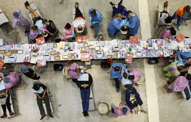 Patients are treated at a free dental clinic put on by volunteers with the California Dental Association Foundation on October 27, 2018 in Modesto, California. The two-day clinic is expected to provide free treatment to about 1,900 people who lack access to dental care. 13 percent of Californians lack public or private dental insurance. Health care is an important issue across California in the upcoming elections. Democratic congressional candidate Josh Harder (CA-10) is competing for the seat against Republican incumbent Rep. Jeff Denham. Democrats are targeting at least six congressional seats in California, currently held by Republicans, where Hillary Clinton won in the 2016 presidential election. These districts have become the centerpiece of their strategy to flip the House and represent nearly one-third of the 23 seats needed for the Democrats to take control of the chamber in the November 6 midterm elections. (Photo by Mario Tama/Getty Images)
