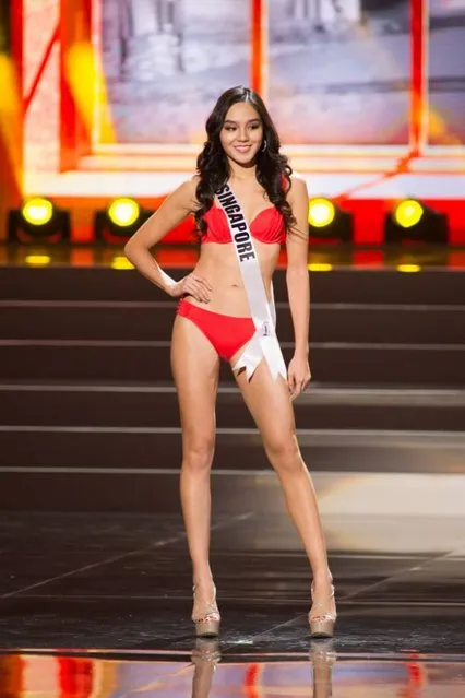 This photo provided by the Miss Universe Organization shows Shi Lim, Miss Singapore 2013, competes in the swimsuit competition during the Preliminary Competition at Crocus City Hall, Moscow, on November 5, 2013. Miss Universe 2013 will be crowned at the pageant final show on November 9. (Photo by Darren Decker/AFP Photo)