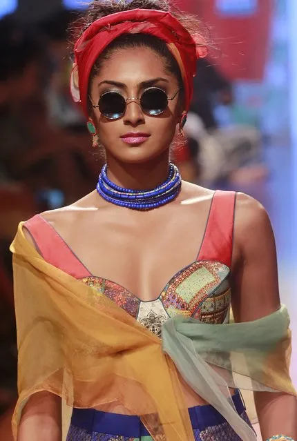 An Indian model displays creations by Tarun Tahiliani during the Lakme Fashion Week Summer Resort 2015 in Mumbai, India, Sunday, March 22, 2015. (Photo by Rafiq Maqbool/AP Photo)