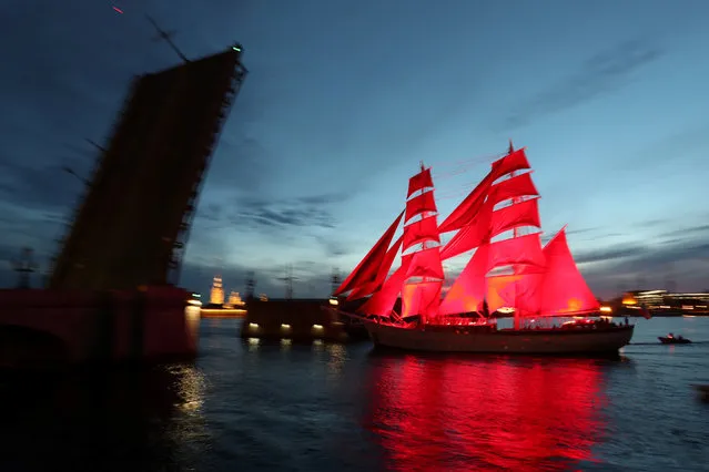 Brig “Rossiya” (Russia) with scarlet sails floats on the Neva River past Troitsky bridge during a rehearsal for the festivities marking school graduation in Saint Petersburg, Russia on June 13, 2019. (Photo by Anton Vaganov/Reuters)