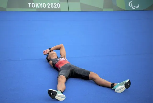 Hideki Uda, from Japan, reacts at the ground after winning the silver medal in the Men's Triathlon PTS4 at the Odaiba Marine Park at the 2020 Paralympics in Tokyo, Saturday, August 28, 2021. (Photo by Joel Marklund/OIS/AP Photo)